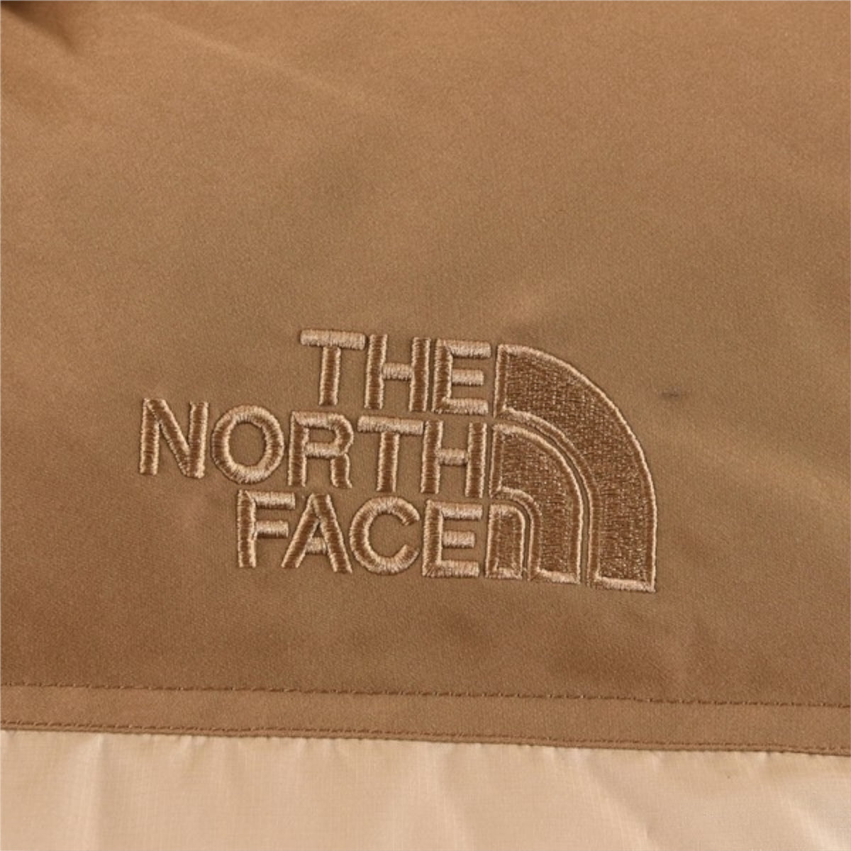 The North Face 1996 Retro Nuptse Jacket – Beige with light brown upper panel.