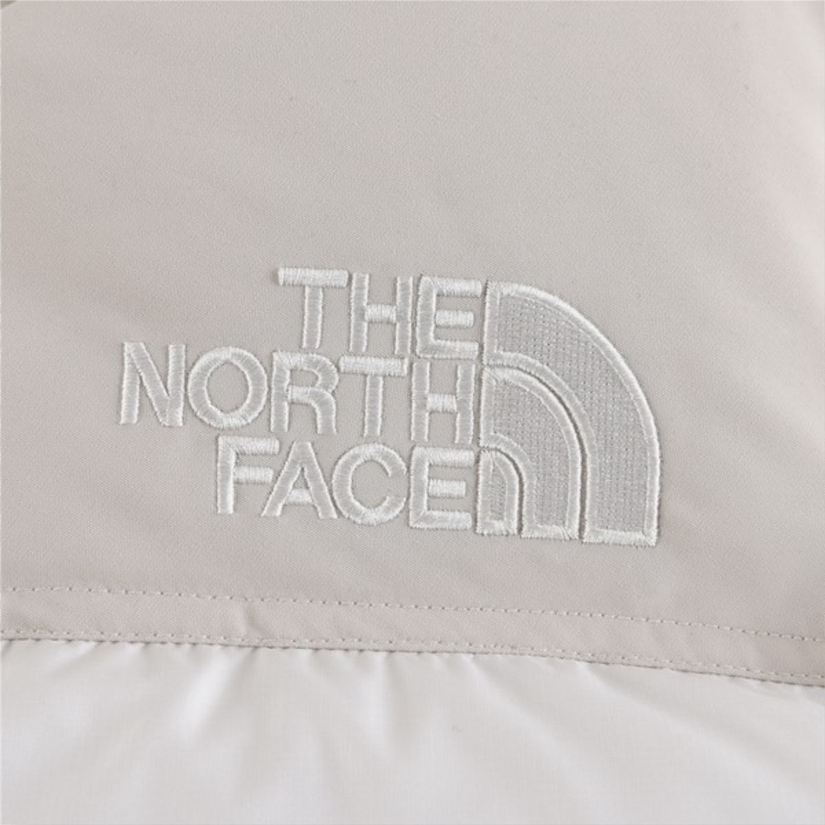 The North Face 1996 Retro Nuptse Jacket – Off-white/cream with light beige upper panel
