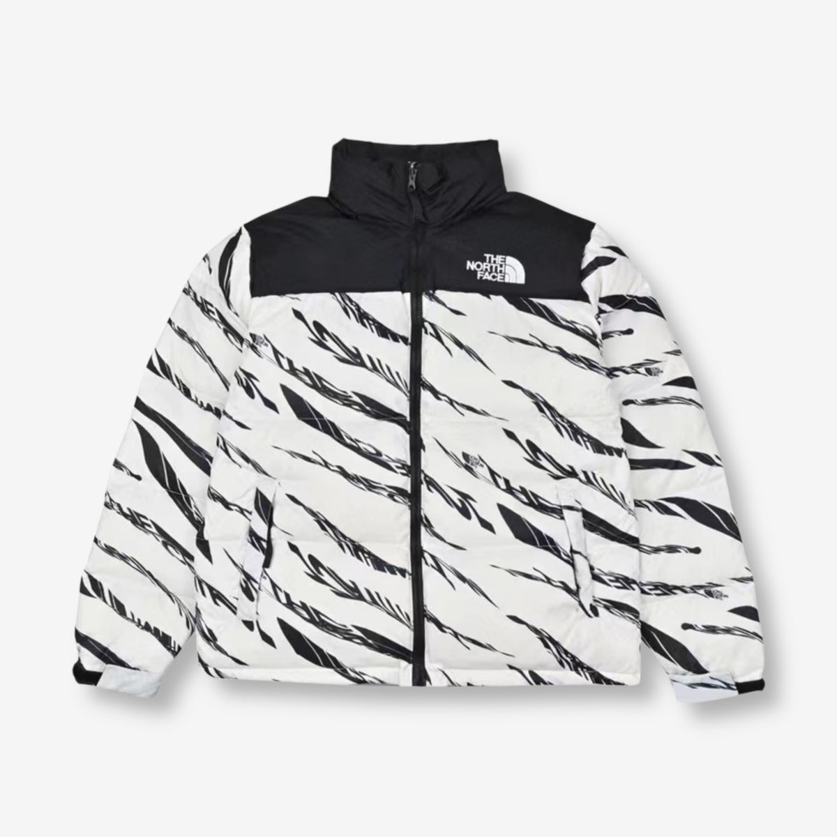 The North Face x KAWS Retro 1996 Nuptse Jacket – White with black abstract KAWS pattern