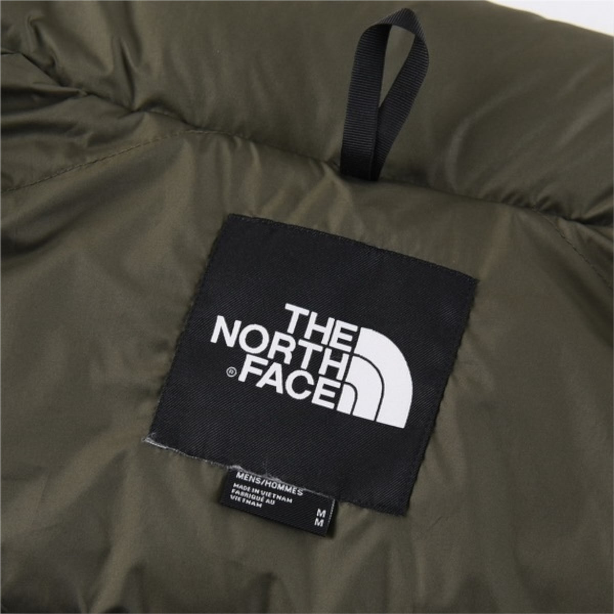 The North Face 1996 Retro Nuptse Jacket – Olive green with dark olive upper panel.