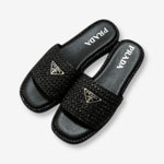 Prada Raffia Slide Sandal “Black Woven”