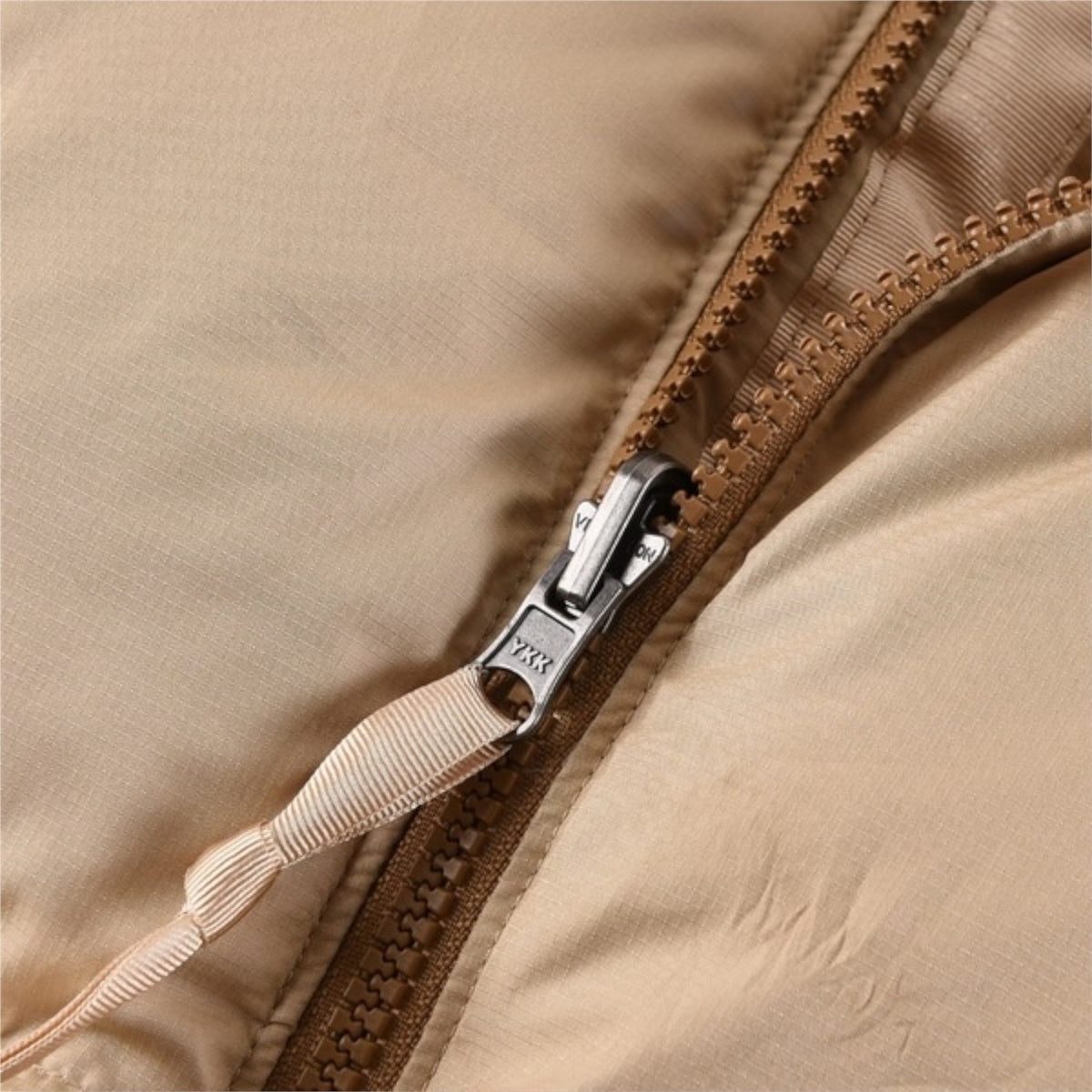 The North Face 1996 Retro Nuptse Jacket – Beige with light brown upper panel.