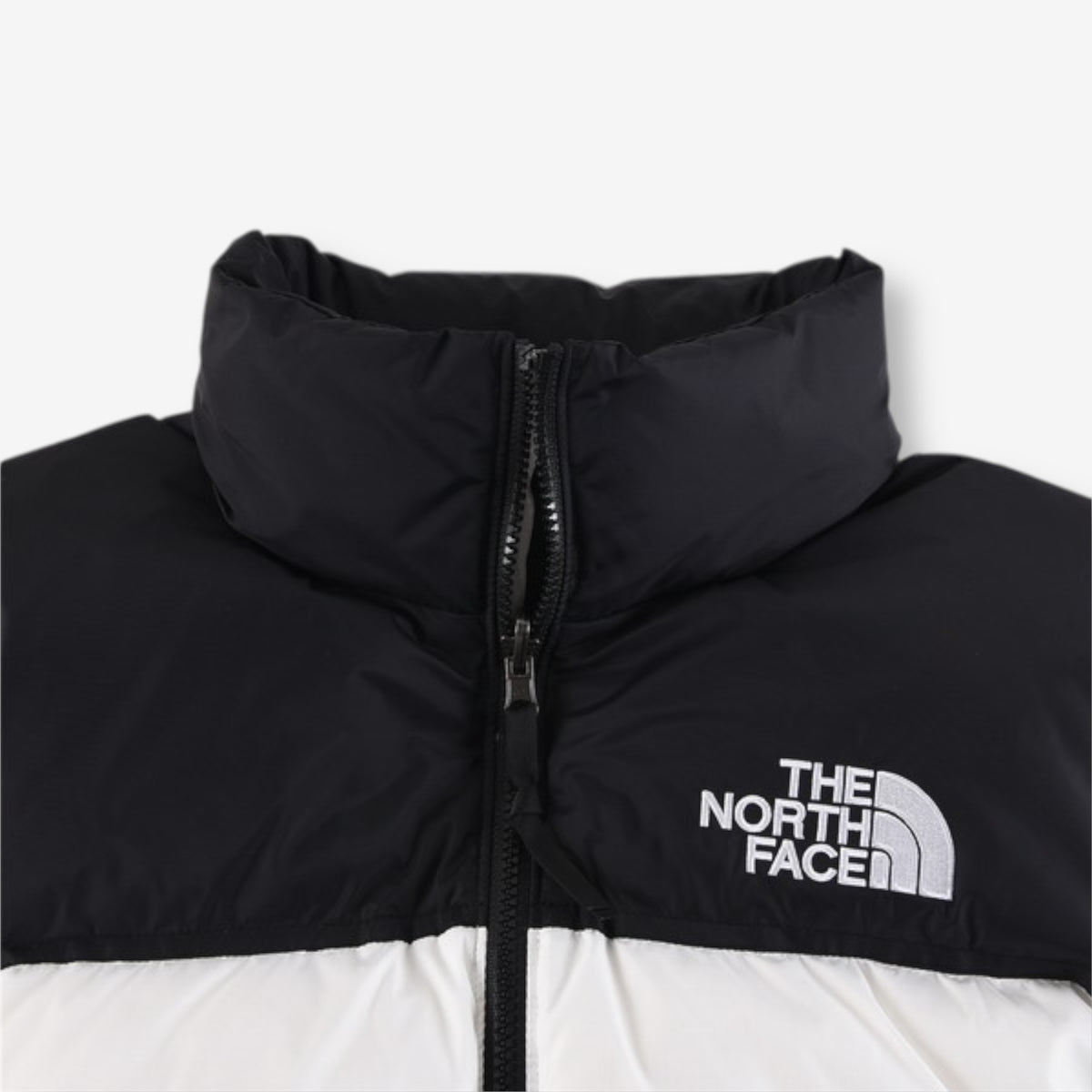 The North Face 1996 Retro Nuptse Jacket – White with black upper panel.