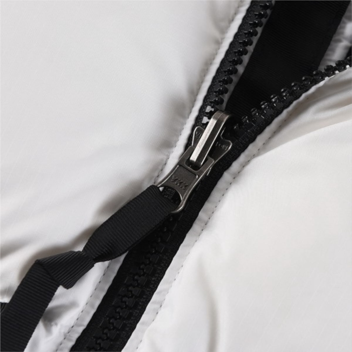 The North Face 1996 Retro Nuptse Jacket – White with black upper panel.